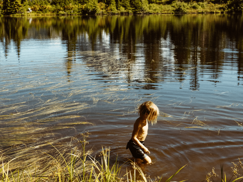 Kid playing in shallow water